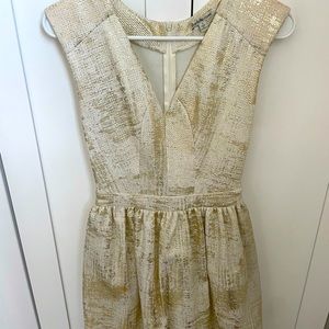 Small, champagne colored cocktail dress